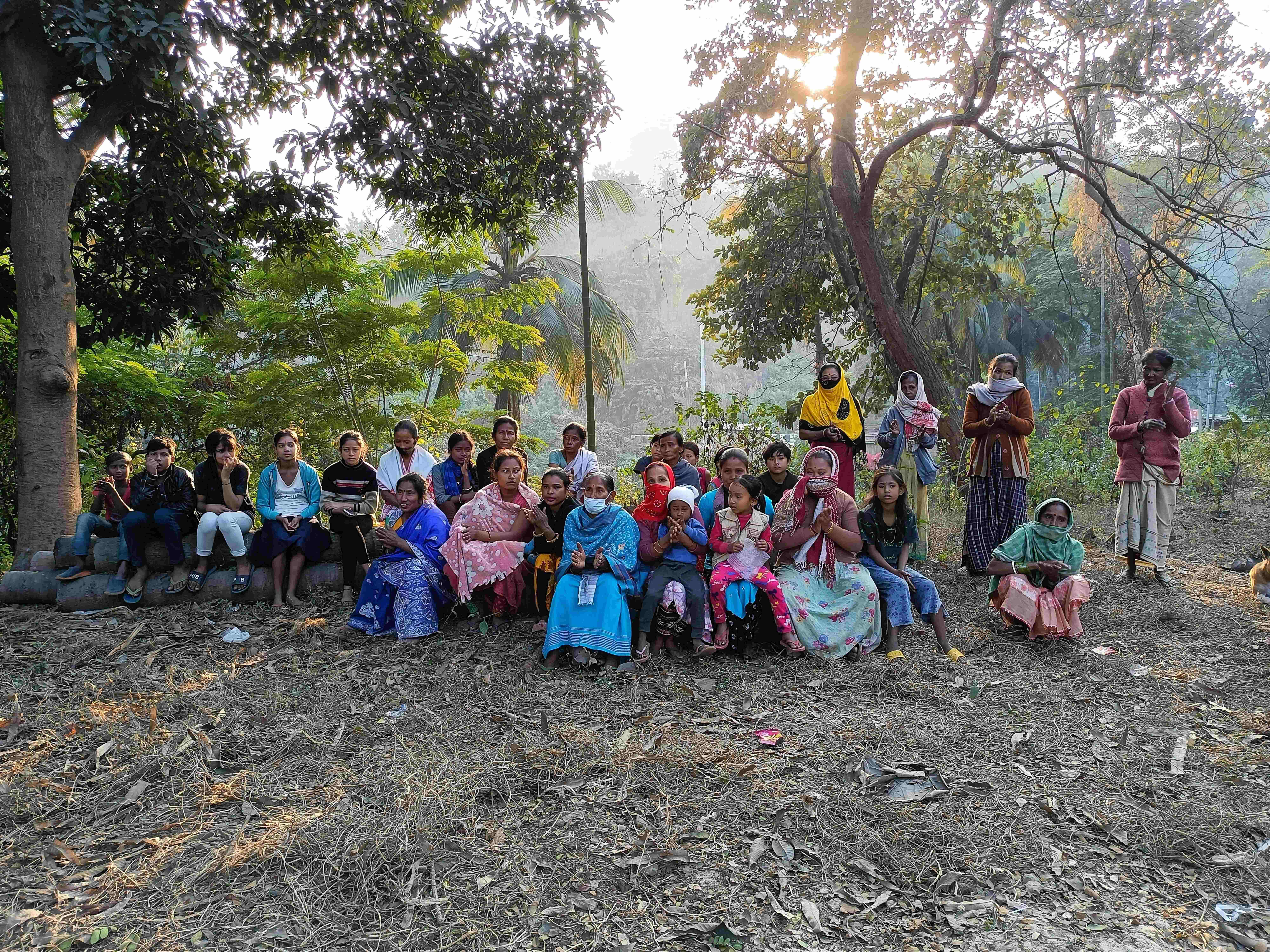 Community gathering in forest setting